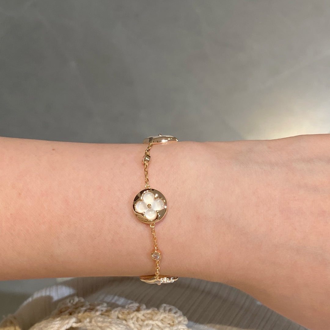 DIANA STAR AND SUN 4 MOTIF WHITE MOP PINK GOLD BRACELET