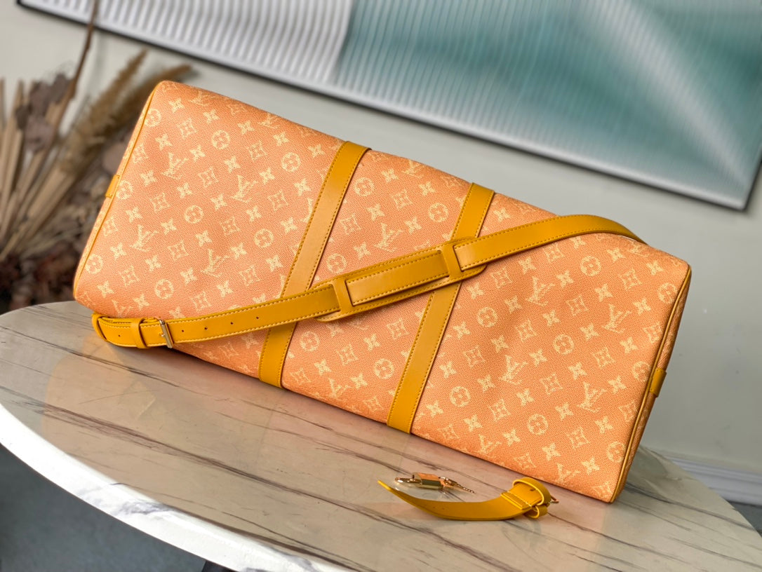 KEEPALL BANDOULI¨¨RE 55 IN ORANGE MONOGRAM HERITAGE CANVAS