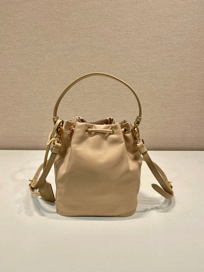 BUCKET BAG 19 IN BEIGE RE-NYLON AND SAFFIANO LEATHER HANDLE