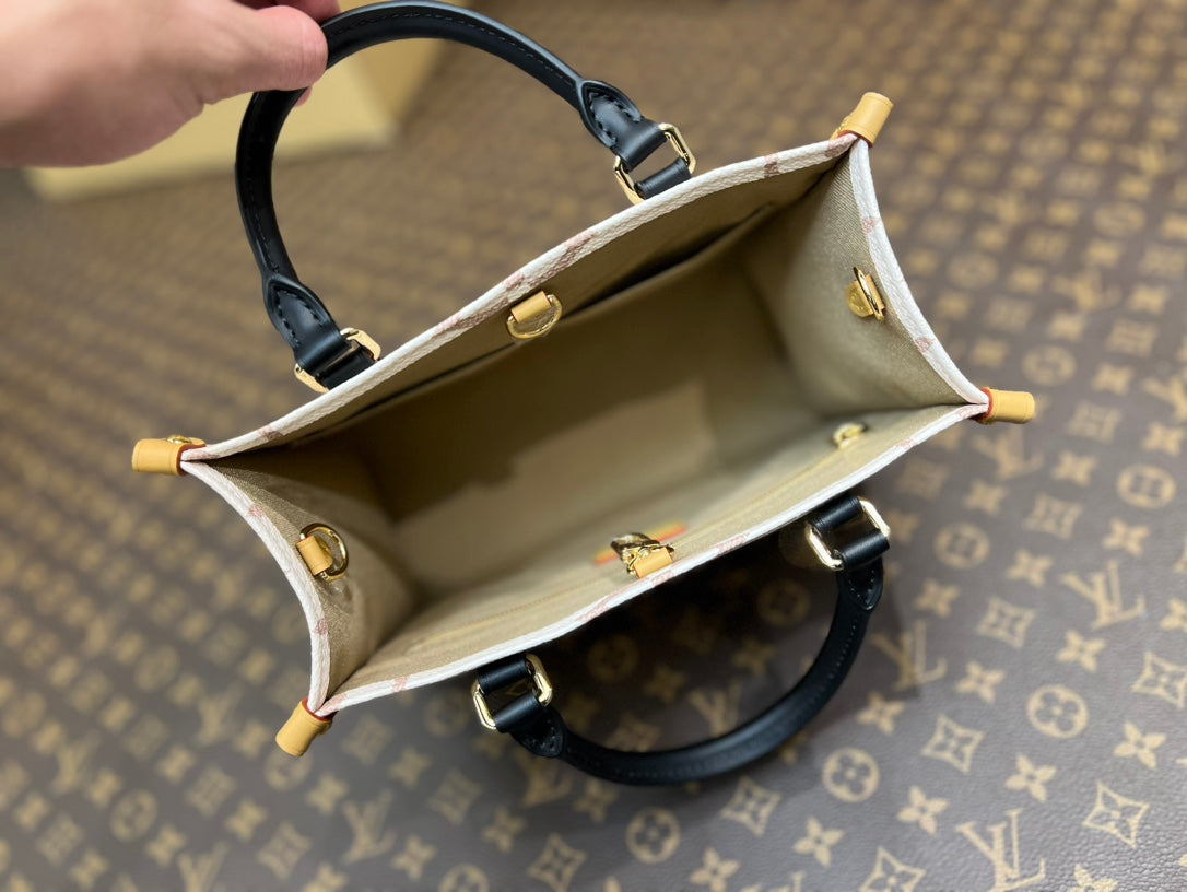 onthego pm 25 cream monogram empreinte embossed calfskin bagcharm