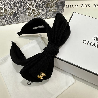 BLACK FABRIC HEADBAND WITH BOW 168569