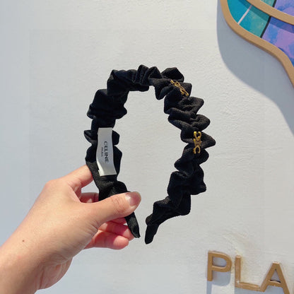 BLACK FABRIC WITH GOLD LOGO HAIRBAND 415931