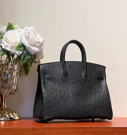 KELLY SELLIER 25 BAG IN BLACK OSTRICH LEATHER WITH GOLD HARDWARE (MADE - TO - ODER)
